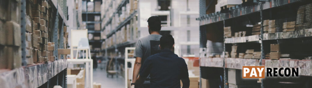 Warehouse worker is walk across the walkway in the warehouse