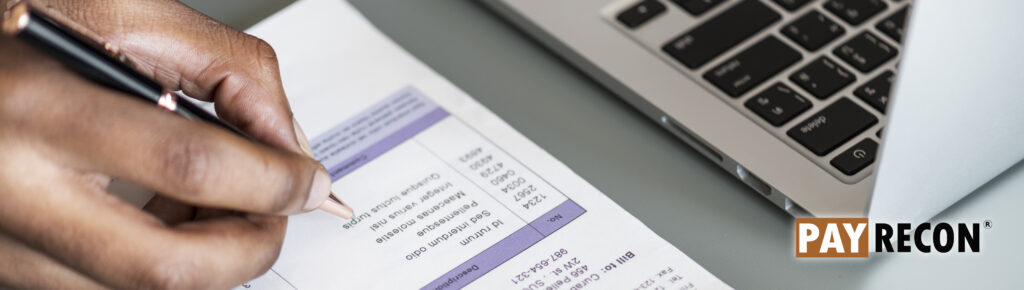 closeup-business-man-checking-tax-invoice-paper