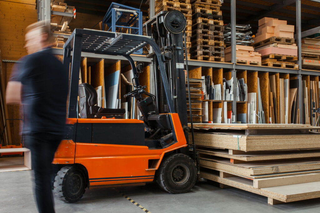 Forklift is carring product to arrange into rack
