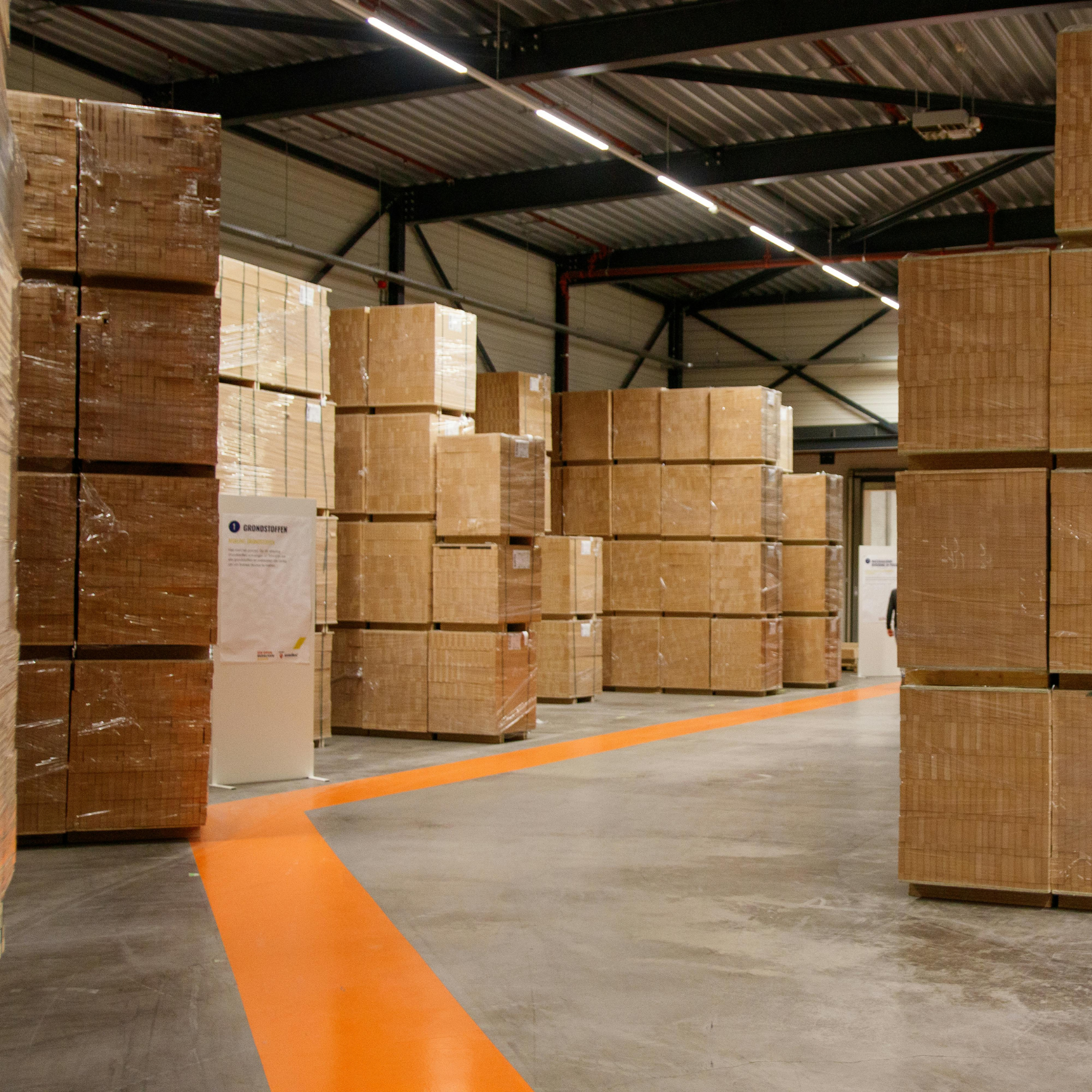 Warehouse storage location optimization with organized racks and inventory placement managed through a warehouse inventory system.