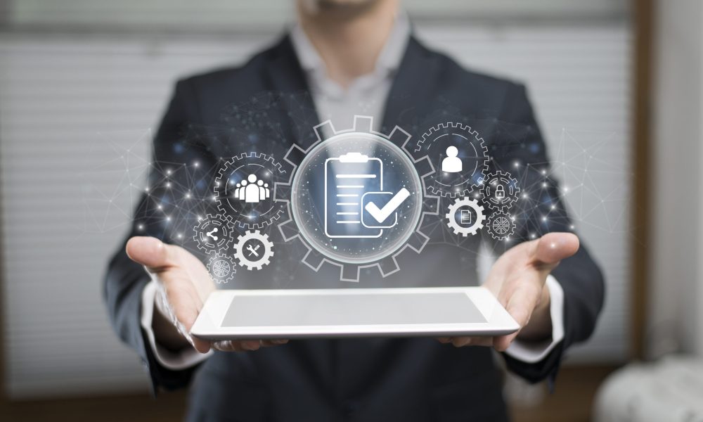 IT professional connecting software systems with APIs and data flow visuals, illustrating tailored system integration for business processes.